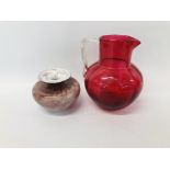 VINTAGE CRANBERRY JUG - H 18CM ALONG WITH AN ART GLASS VASE - H 9CM.