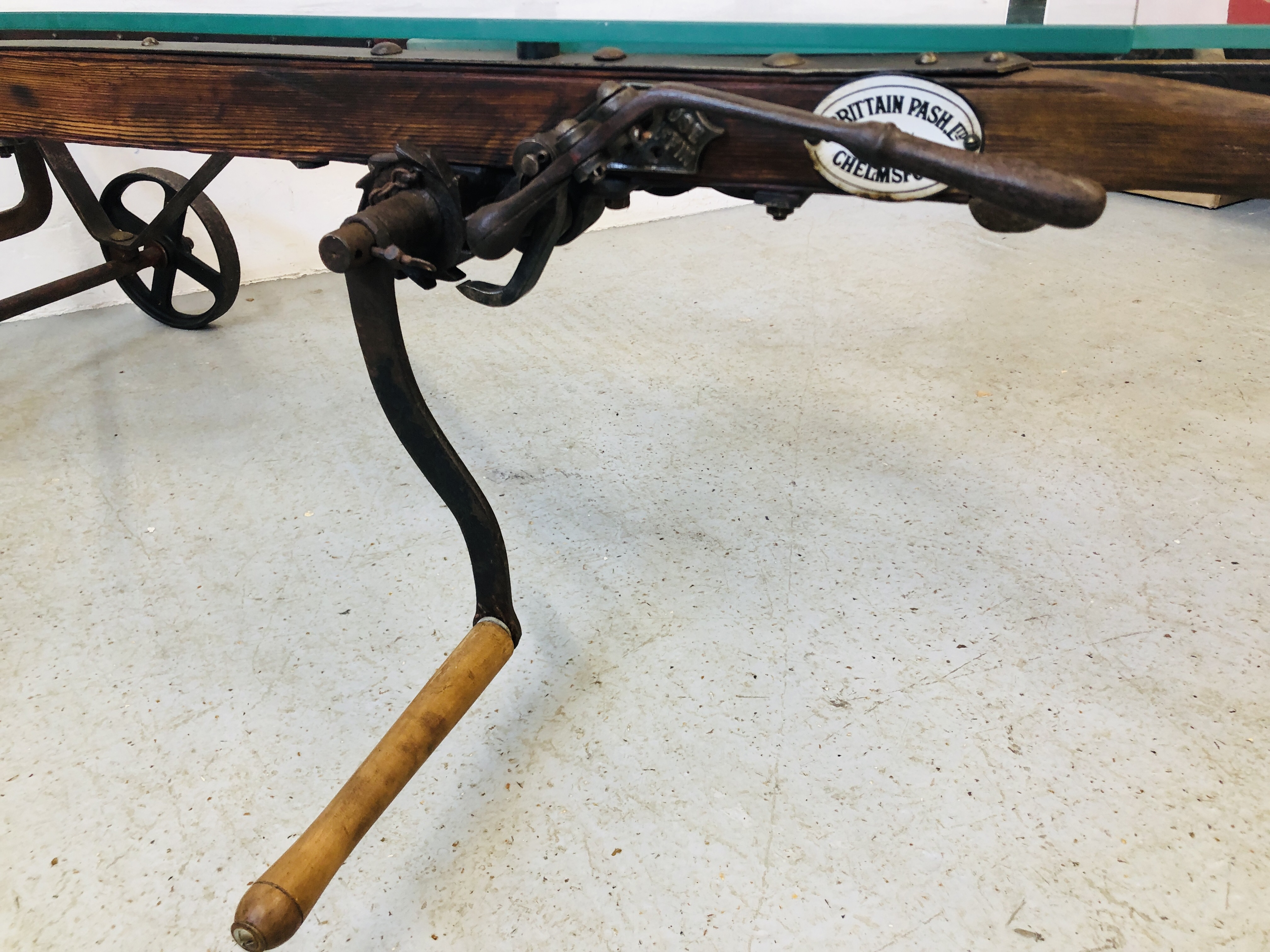 A GLASS TOP EXTENDING COFFEE TABLE CONVERTED FROM AN ANTIQUE COOKS RATCHET ACTION SACK BARROW - Image 5 of 22