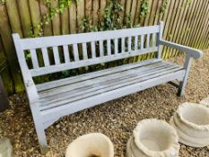 A WOODEN GARDEN BENCH