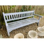 A WOODEN GARDEN BENCH