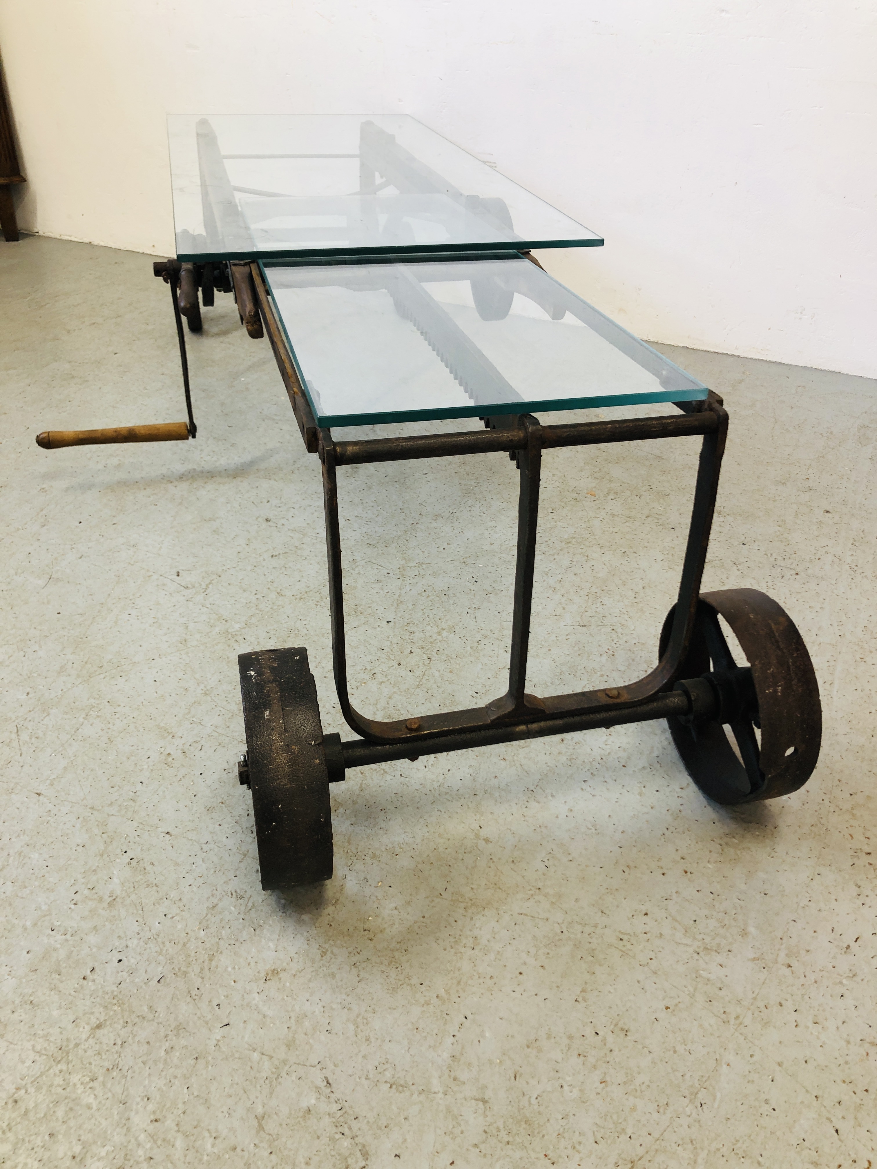 A GLASS TOP EXTENDING COFFEE TABLE CONVERTED FROM AN ANTIQUE COOKS RATCHET ACTION SACK BARROW - Image 3 of 22