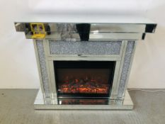 A MODERN DESIGNER MIRRORED GLASS ELECTRIC FIRE SURROUND WITH FLAME EFFECT - SOLD AS SEEN