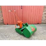 A SUFFOLK SUPER PUNCH LAWN MOWER WITH SPARES