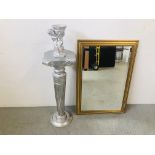 A GILT FRAMED BEVELLED GLASS MIRROR AND A SILVERED FINISH TORCHIERE WITH CHERUB FIGURE - SOLD AS