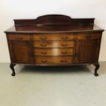 LARGE MAHOGANY BOW FRONT SIDEBOARD WITH FOUR CENTRAL DRAWERS FLANKED BY SINGLE DRAWERS AND CABINETS