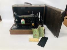 A SINGER SEWING MACHINE IN FITTED CASE