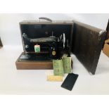 A SINGER SEWING MACHINE IN FITTED CASE