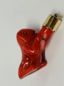 A RED HARDSTONE SQUIRREL CHARM WITH YELLOW METAL MOUNT