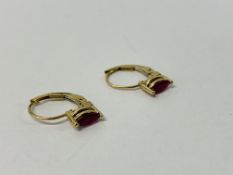 PAIR OF YELLOW METAL RUBY SET EARRINGS