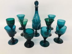 A MATCHED GROUP OF ELEVEN GEORGIAN CONICAL GREEN GLASS WINES PLUS GREEN GLASS DECANTER