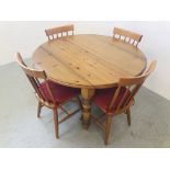 A HONEY PINE CIRCULAR EXTENDING DINING TABLE WITH DROP FLAP SIDES ALONG WITH A SET OF 4 STICK BACK