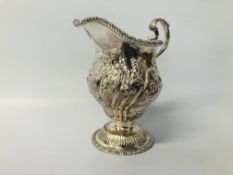 C19TH SILVER CREAM JUG OF DOUBLE OGEE FORM, SCROLLED HANDLE - H 11CM.