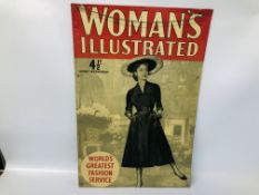 A WOMAN'S OWN ILLUSTRATED METAL SIGN