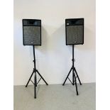A PAIR OF PEAVEY PRO-15 SPEAKERS ON GORILLA STANDS - SOLD AS SEEN