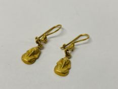 A PAIR OF EGYPTIAN YELLOW METAL EARRINGS