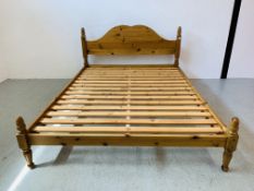 A PINE KING SIZE BEDSTEAD