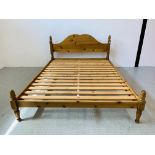 A PINE KING SIZE BEDSTEAD
