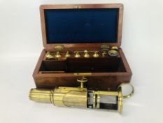 A VINTAGE BRASS MICROSCOPE IN FITTED WOODEN CASE