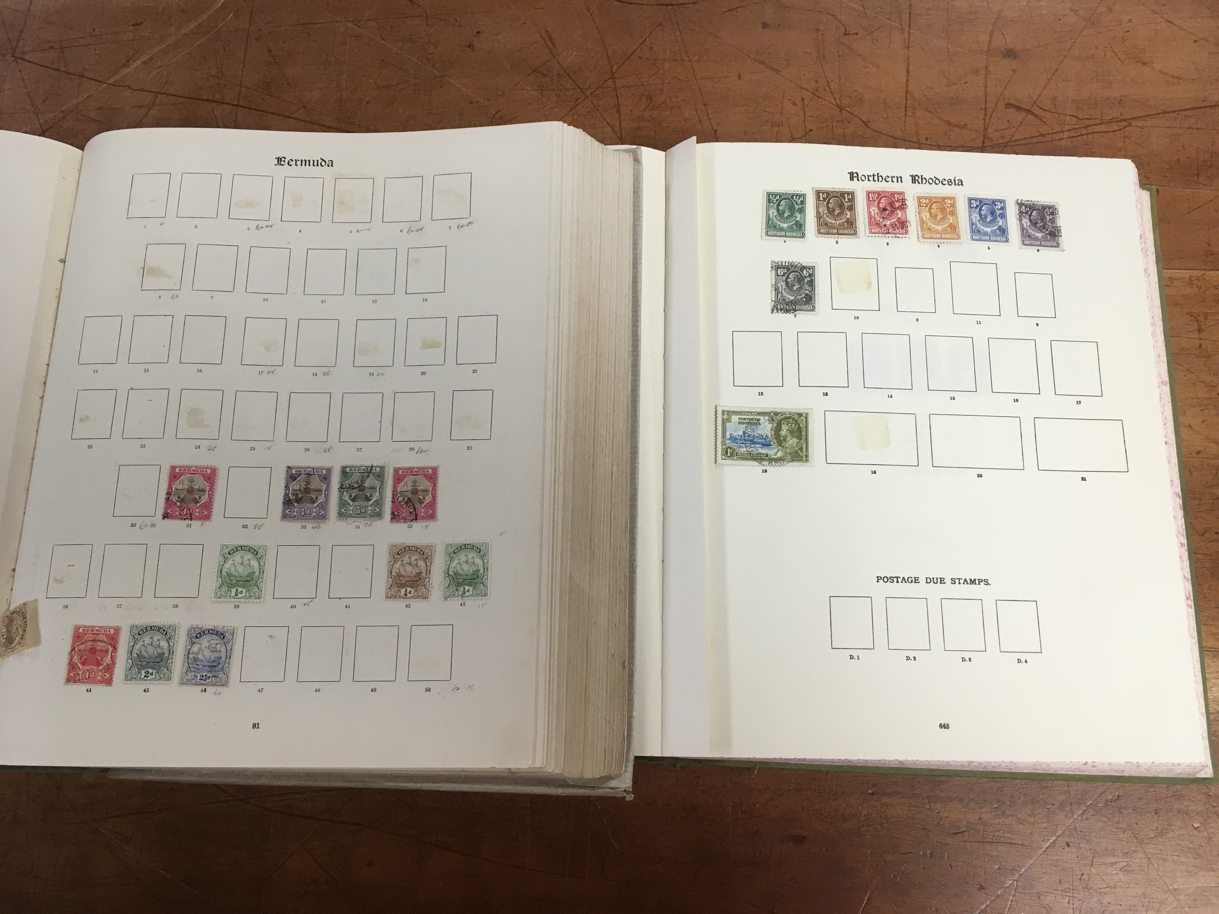 SG NEW IMPERIAL ALBUMS, BOTH VOLUMES WITH A REMAINDERED COLLECTION, A FEW HUNDRED STAMPS REMAIN.