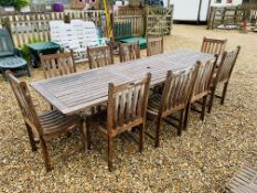 A WESTMINSTER TEAK EXTENDING GARDEN TABLE AND A SET OF TEN DINING CHAIRS PLUS 2 RECLINING SUN