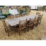 A WESTMINSTER TEAK EXTENDING GARDEN TABLE AND A SET OF TEN DINING CHAIRS PLUS 2 RECLINING SUN