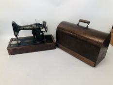 A SINGER SEWING MACHINE IN CASE - SOLD AS SEEN