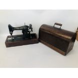 A SINGER SEWING MACHINE IN CASE - SOLD AS SEEN