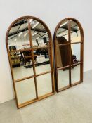 A PAIR OF ARCHED TOP GLASS PANEL WALL MIRRORS, HEIGHT 110CM,