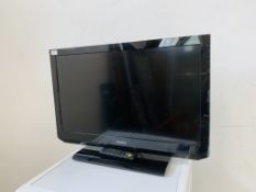 A TOSHIBA 32 INCH TELEVISION WITH REMOTE - SOLD AS SEEN