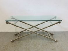 A DESIGNER CHROME FRAMED GLASS TOP CONSOLE TABLE THE X SECTION SUPPORT WITH SPHERE FINIALS W 157CM,