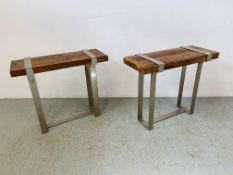 A PAIR OF DESIGNER STAINLESS STEEL FRAMED SIDE TABLES WITH RUSTIC HARDWOOD TOPS