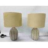 A PAIR OF MODERN TABLE LAMPS WITH CREAM SHADES HEIGHT 53CM - SOLD AS SEEN