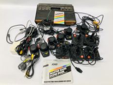 AN ATARI VIDEO COMPUTER SYSTEM AND ACCESSORIES - SOLD AS SEEN