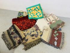 A COLLECTION OF SEVEN VARIOUS PATTERNED THROWS AND EMBROIDERIES PLUS CUSHION