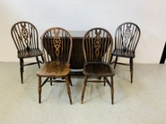 A DARK OAK FINISH OVAL TOP GATELEG DINING TABLE AND A SET OF 4 TRADITIONAL WHEEL BACK DINING CHAIRS