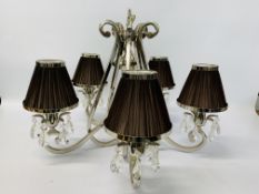 A MODERN DESIGNER CHROME AND CRYSTAL FIVE BRANCH CENTRE LIGHT FITTING COMPLETE WITH PLEATED SATIN