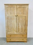 A LIMED PINE DOUBLE WARDROBE WITH TWO BASE DRAWERS - W 116CM. D 48CM. H 194CM.