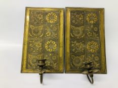 A PAIR OF VINTAGE BRASS EMBOSSED PLAQUE WALL HANGING CANDLE HOLDERS H 33CM,