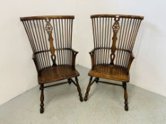 A PAIR OF TRADITIONAL STICK BACK CARVER CHAIRS WITH ELM SEATS AND WHEEL DESIGN