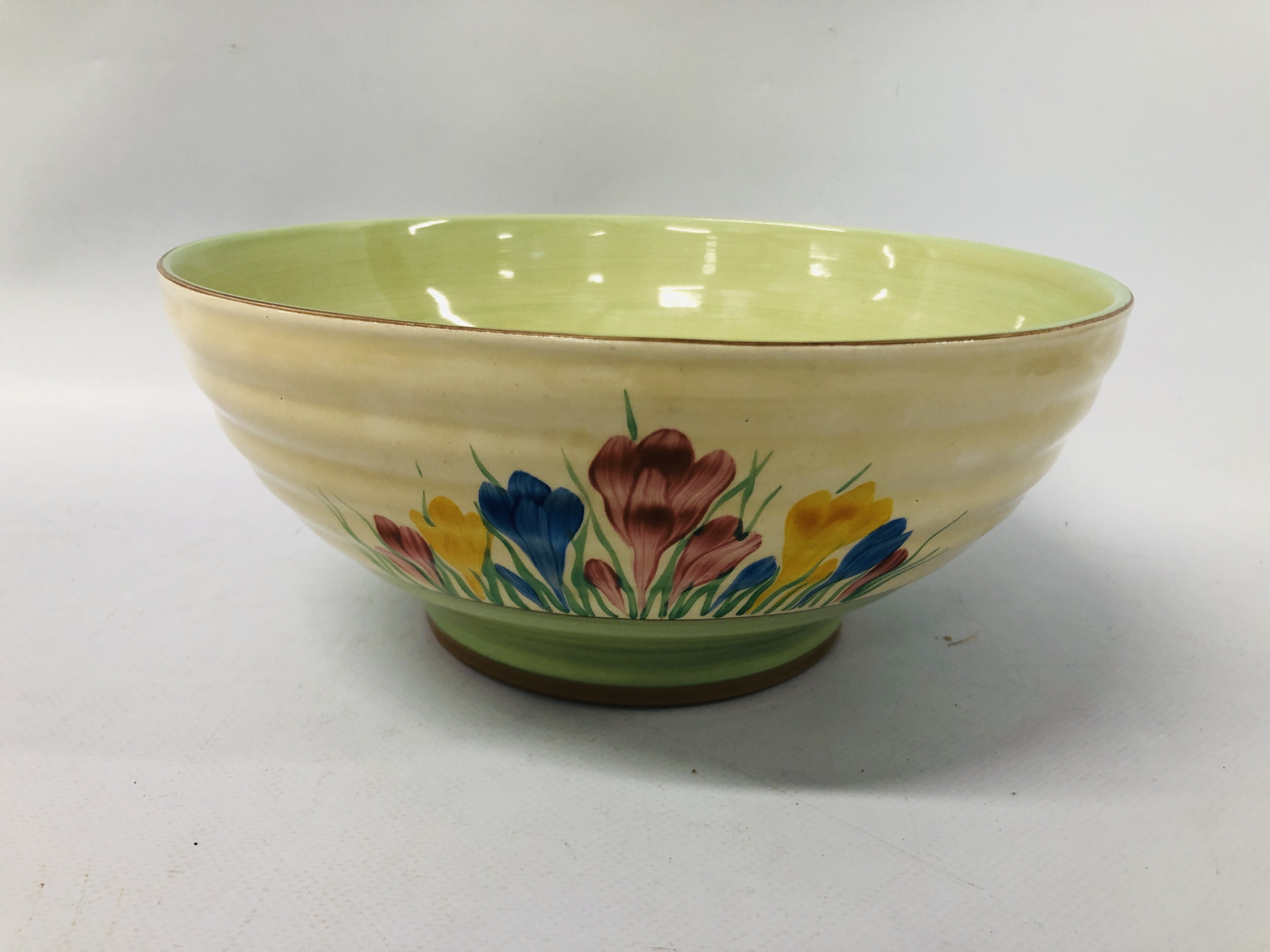 A CLARICE CLIFF "SPRING" CROCUS PATTERN BOWL - 24CM DIAMETER. 10.5CM HIGH.