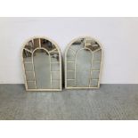 A PAIR OF ARCHED DECORATIVE WALL MIRRORS IN METALWORK FRAMES W 51CM,