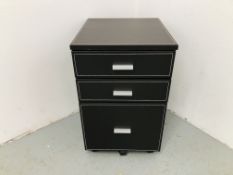 A FAUX LEATHER 3 DRAWER FILING CABINET