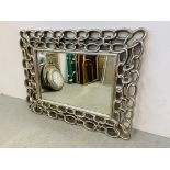 A DESIGNER RECTANGULAR BEVELLED WALL MIRROR IN SILVERED CHAIN LINK DESIGN FRAMEWORK - OVERALL W