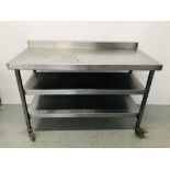 A STAINLESS STEEL COMMERCIAL CATERING THREE TIER PREPARATION TABLE ON CASTORS L 130CM.