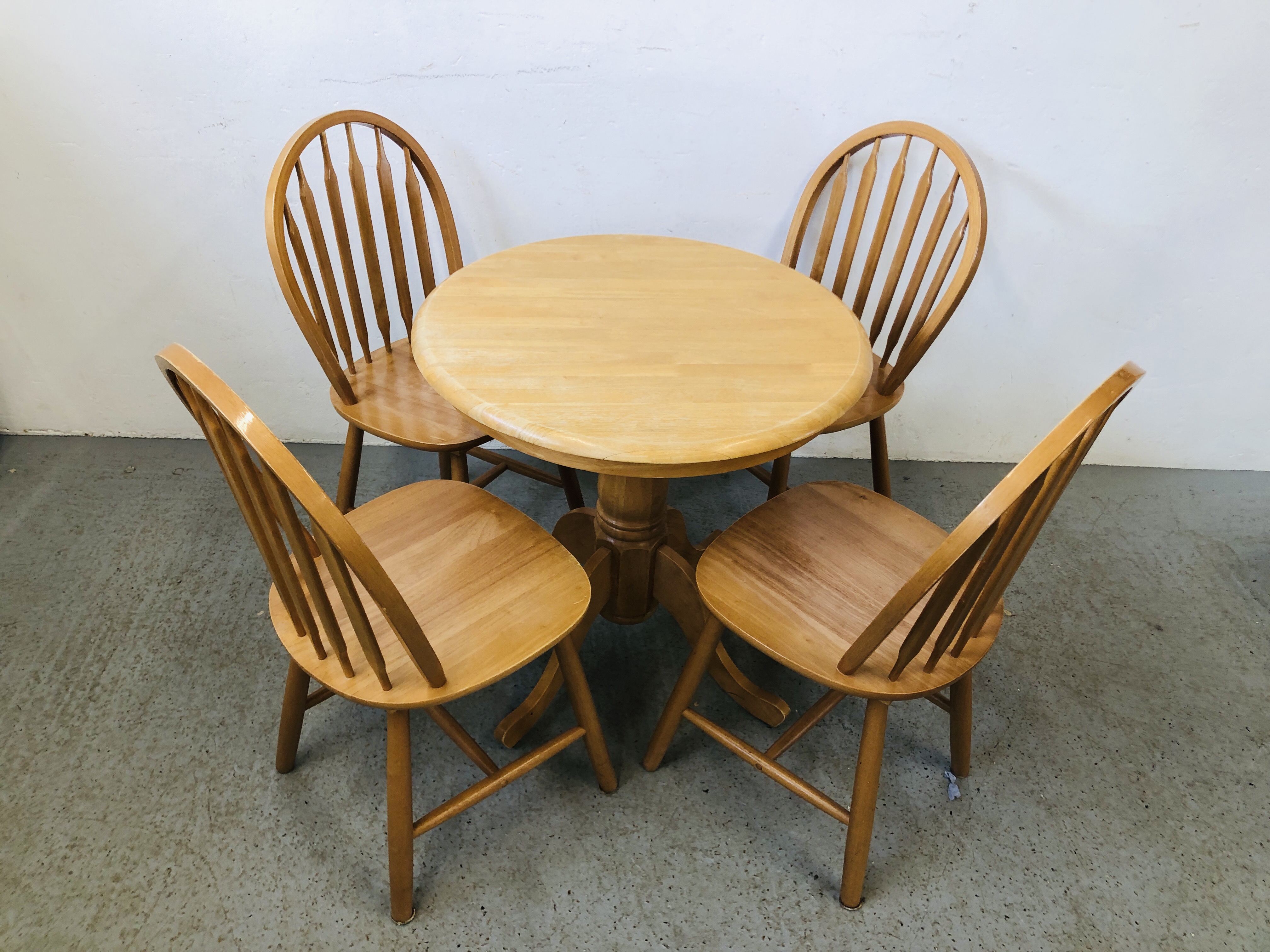 MODERN SINGLE PEDESTAL BREAKFAST TABLE ALONG WITH A SET OF FOUR HOOP BACK DINING CHAIRS