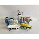 A COLLECTION OF EIGHT COW PARADE ORNAMENTS "A COW NEEDS A BULL LIKE A FISH NEEDS A BICYCLE",