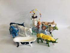 A COLLECTION OF EIGHT COW PARADE ORNAMENTS "A COW NEEDS A BULL LIKE A FISH NEEDS A BICYCLE",