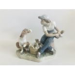 A LLADRO FIGURE BOY WITH DOG AND PUPPIES