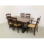 A BESPOKE HAND CRAFTED SOLID OAK DINING TABLE AND SET OF SIX OAK LADDER BACK RUSH SEATED DINING