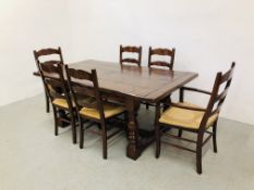 A BESPOKE HAND CRAFTED SOLID OAK DINING TABLE AND SET OF SIX OAK LADDER BACK RUSH SEATED DINING